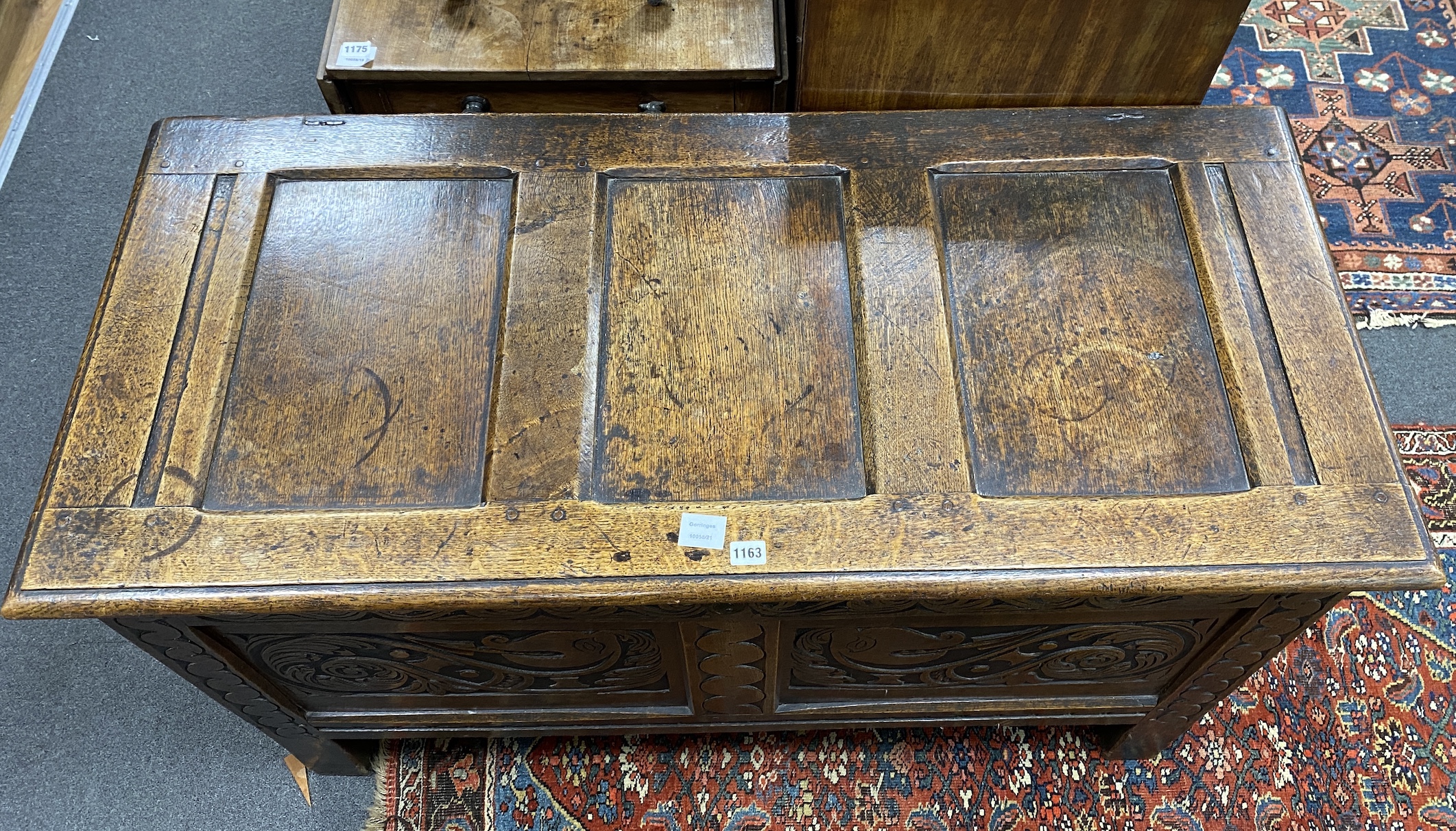 An 18th century panelled oak coffer, length 124cm, depth 56cm, height 73cm